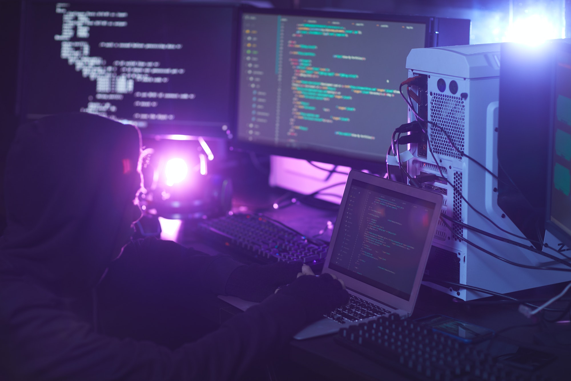 Computer Hacker Coding in Dark